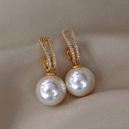 Brilliant pearl earrings with sparkling zirconias