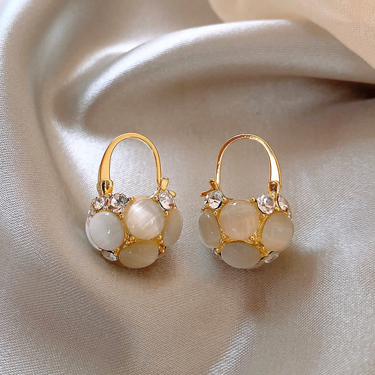 Elegant gold pearl earrings with sparkling crystals