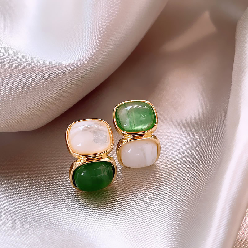 Elegant Gold Earrings Featuring a Dazzling White and Vibrant Green Gemstone