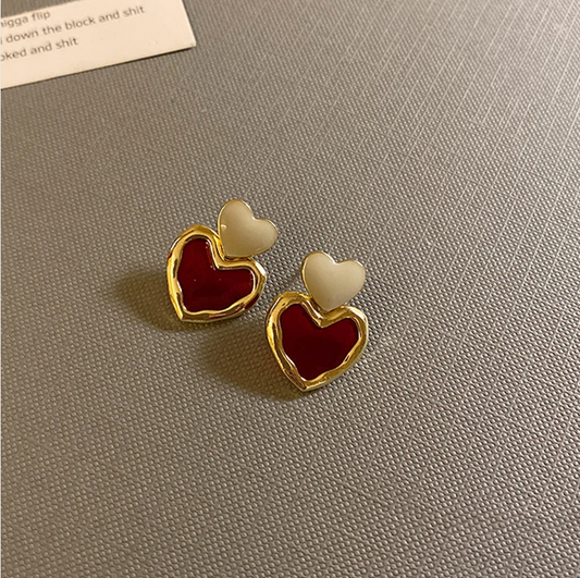 Chic Gold Earrings Adorned with Red Enamel Heart Accents