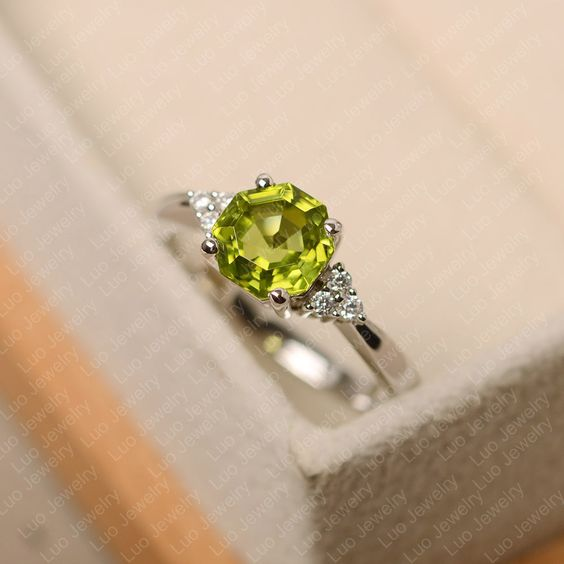 Elegant silver ring with sparkling olive crystal