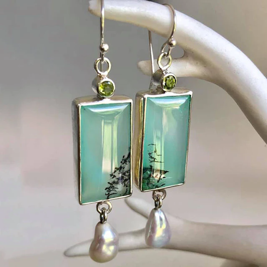 Elegant pearl earrings with bright green enamel