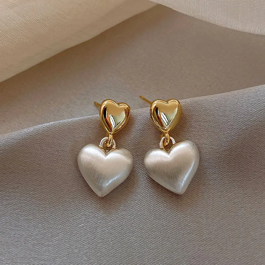 Radiant Heart Earrings Adorned with Luxurious Golden Pearls