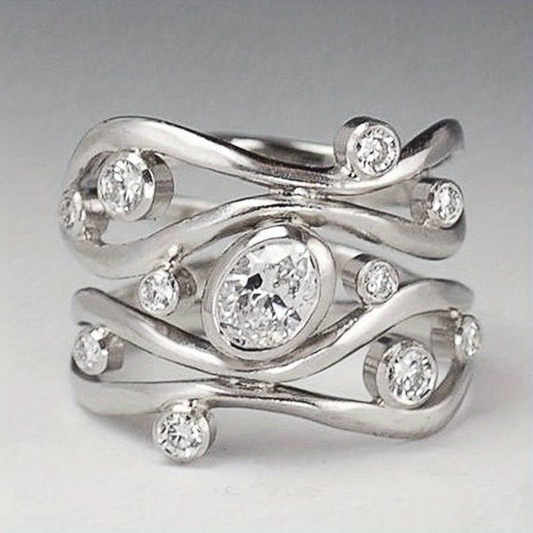 Elegant vintage silver ring with irregular zirconia stones