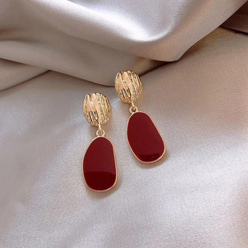 Elegant Gold Earrings with Vibrant Red Accents