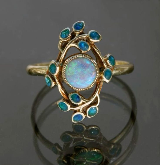 Elegant vintage ring with sparkling crystals and precious opal