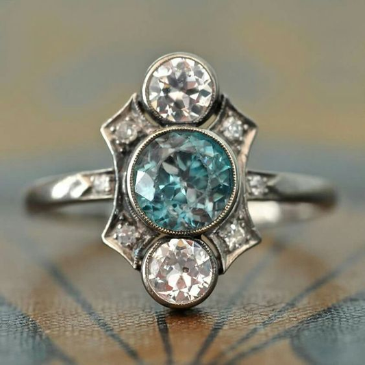 Elegant vintage silver ring with sparkling blue and white crystals