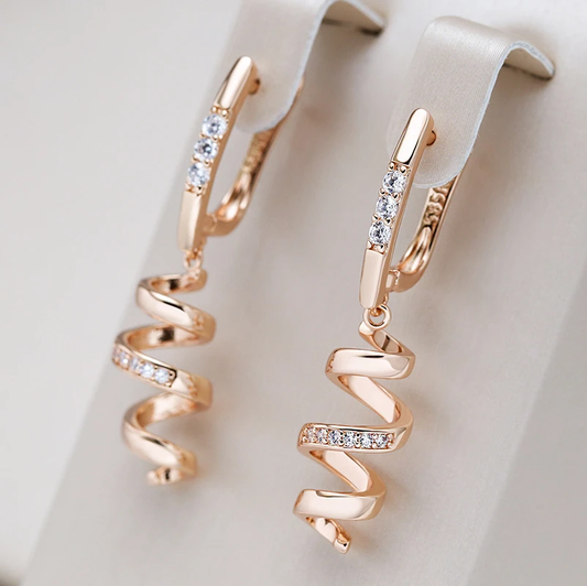 Elegant Gold Spiral Earrings Adorned with Dazzling Zirconia Stones