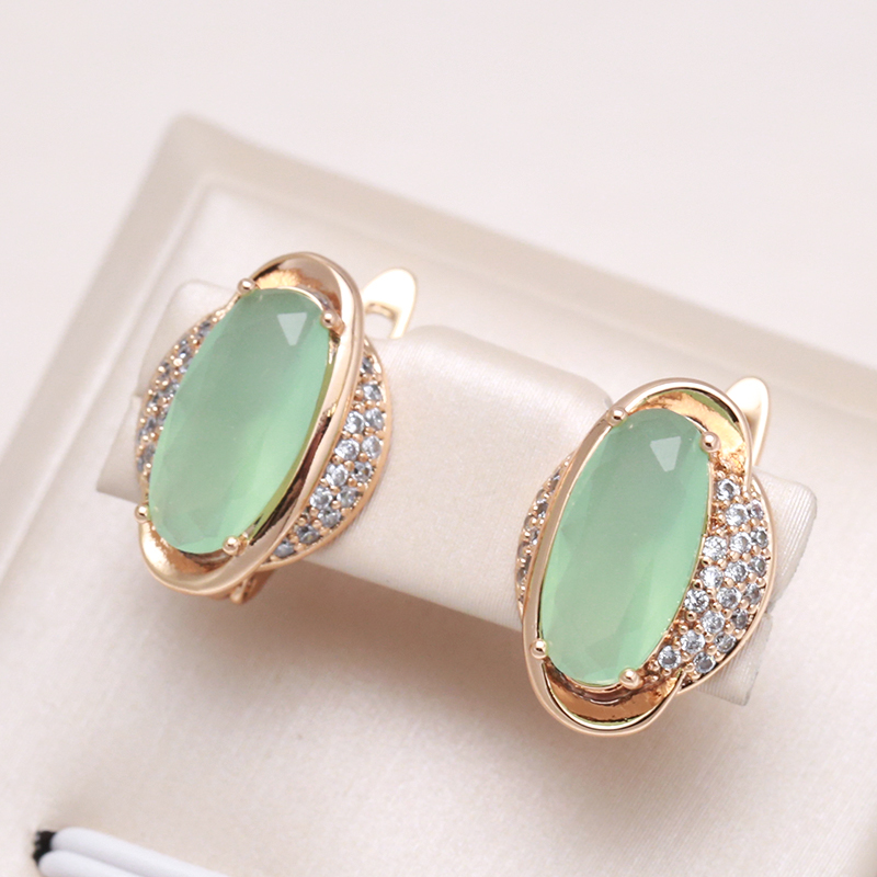 Stunning Gold Earrings Featuring a Dazzling Green Crystal Accent