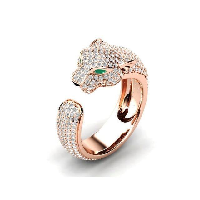 Elegant adjustable jaguar ring made of 18K silver and shiny 18K rose gold, adorned with sparkling green zirconia eyes